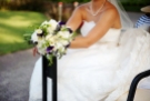 Bridal bouquet featuring white freesia and purple sweat pea