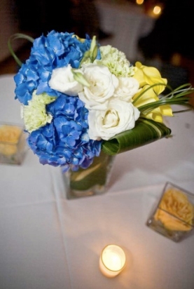 blue hydrangea, white lisianthus, and yellow roses